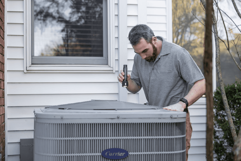 Technician evaluating when to replace an air conditioner in Johnstown NY