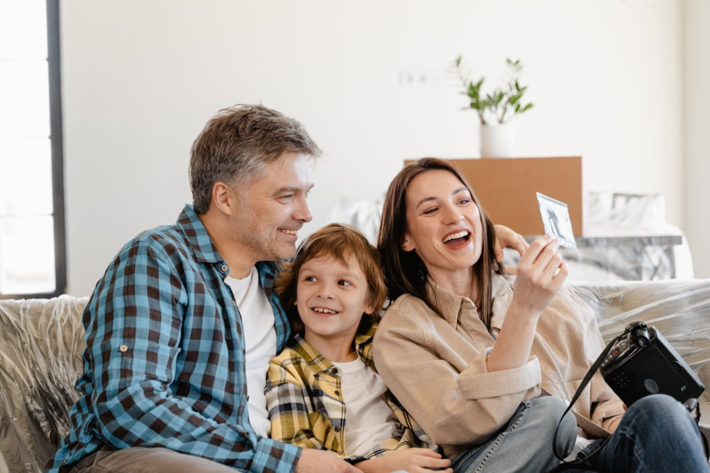 A happy family sitting on a sofa
